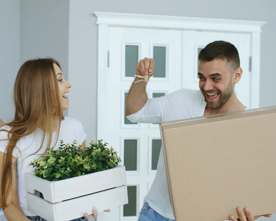 A happy couple holding up the keys to their new home